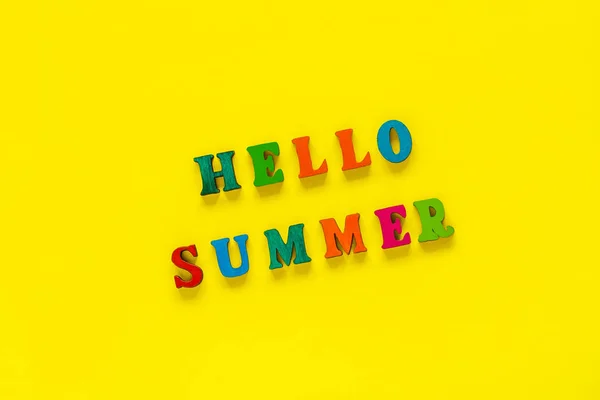 Inscription Hello Summer from colorful letters on yellow backgro — Stock Photo, Image