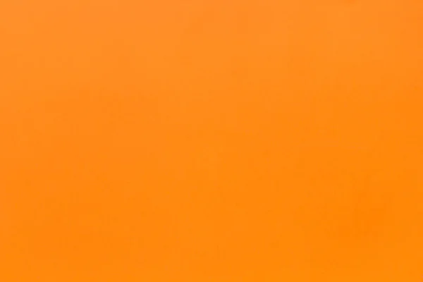 Новая текстура плотная оранжевый цвет бумаги, фон — стоковое фото