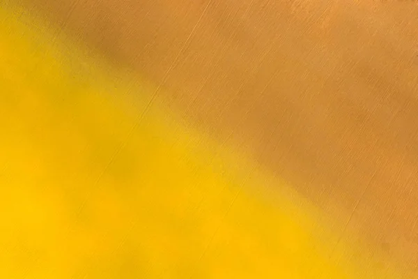 Металева поверхня пофарбована в жовтий і коричневий колір — стокове фото