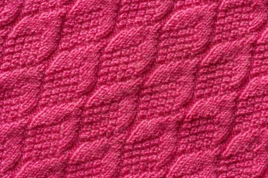 Pembe örme kumaş, arka plan veya doku parçası. Örgü iplik el yapımı