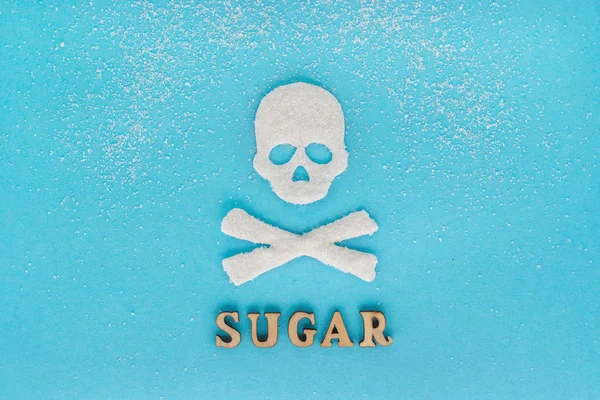 Huesos del cráneo azúcar, dispersión de azúcar granulada, Texto AZÚCAR, b — Foto de Stock