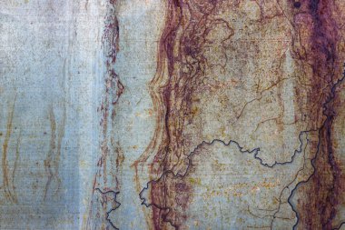 Doku veya arka plan olarak korozyon ve mavi çizgiler ile metalik paslı boyalı yüzey