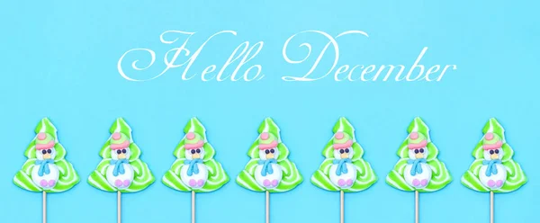 Text Hello December Candy Lollipops Funny Snowman Christmas Tree Blue — Stock Photo, Image