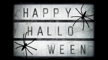 Açın ve metin Mutlu halloween dekore örümcek ağları ve örümcekler, closeup ile lightbox kapatın. Cadılar Bayramı konsepti