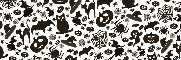 Abstract halloween pattern in cartoon style on white background. Paper art. Happy hallowen holiday concept. Banner.