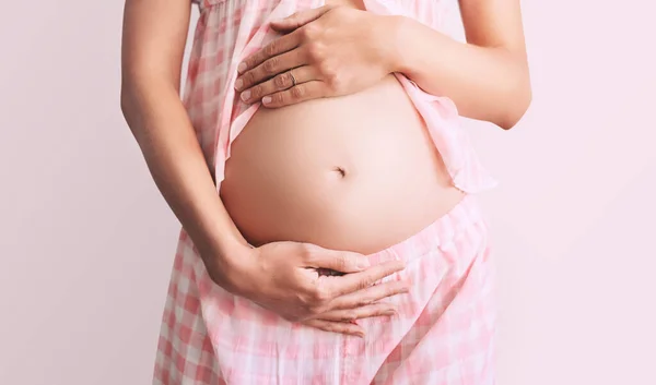 Young Pregnant Woman Home Pajamas Holds Hands Belly White Background — Stock Photo, Image