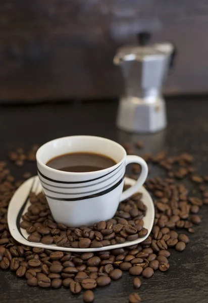 cup of coffee and spilled beans