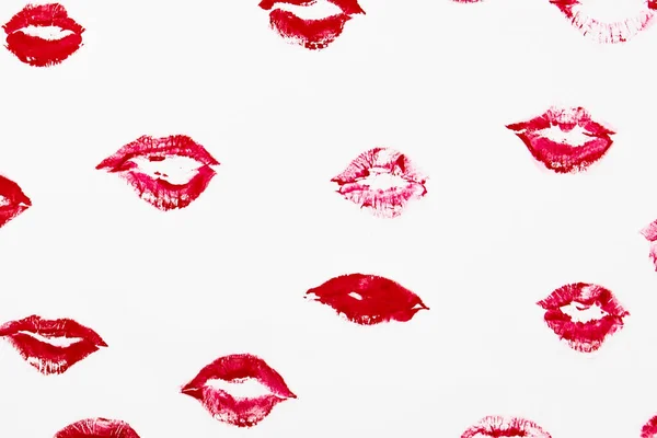 The red lips kisses on a white background. Lipstick kisses set. Kiss lipstick marks for your design. Sexy glossy lip makeup for design. Romantic sign for Valentine day