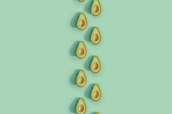 Avocado kleur op een solide achtergrond, de bovenste weergave patroon — Stockfoto