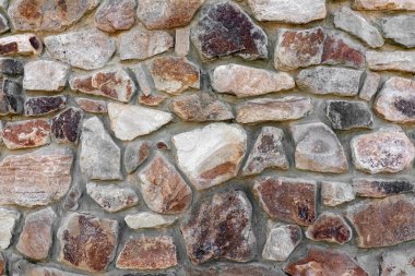 Duvarın duvarları kaldırım taşlarını yakın plan olarak kullanıyor.