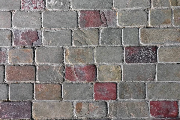 masonry wall paving stones as a background close up