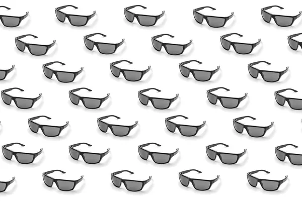 Colorful pattern of sunglasses on a white background top view — Stock Photo, Image