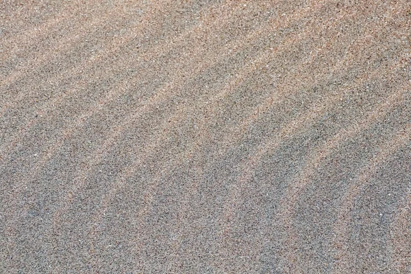 Песок на пляже в качестве фона. Дюнный песок — стоковое фото