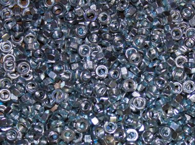 Küçük endüstriyel somunların ve cıvataların dokusu