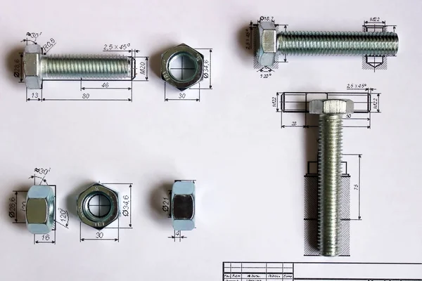 bolts and nuts on technical documentation background