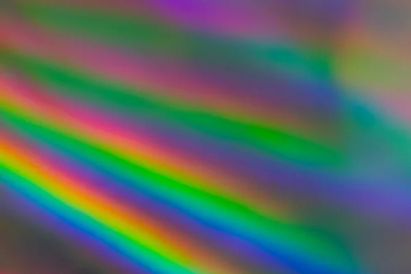 gökkuşağı ışıkları ile renkli holografik kağıt.