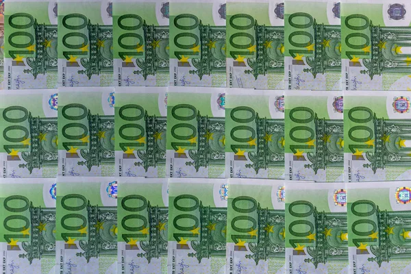 Billetes 100 euros de dinero en euros bellamente dispuestos. Textura de fondo vista superior — Foto de Stock