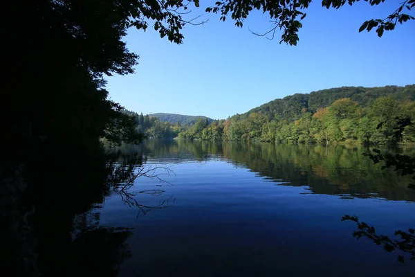 Beautiful reflection on a lake in Plitvice Lakes National Park in Croatia in the early morning