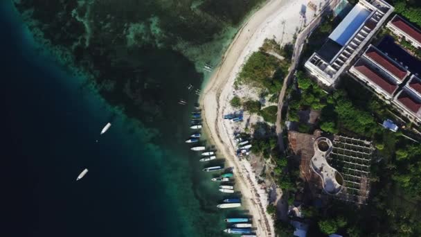 Aerial drone view of boats anchored in the bay with clear and turquoise water. — Stock Video