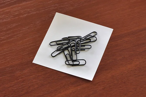 paper clips on a piece of paper