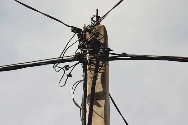 connecting the wires at the top of the post