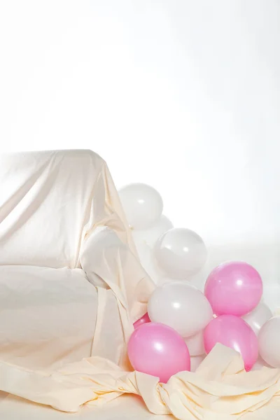 Interior with balloons and sofa — Stock Photo, Image