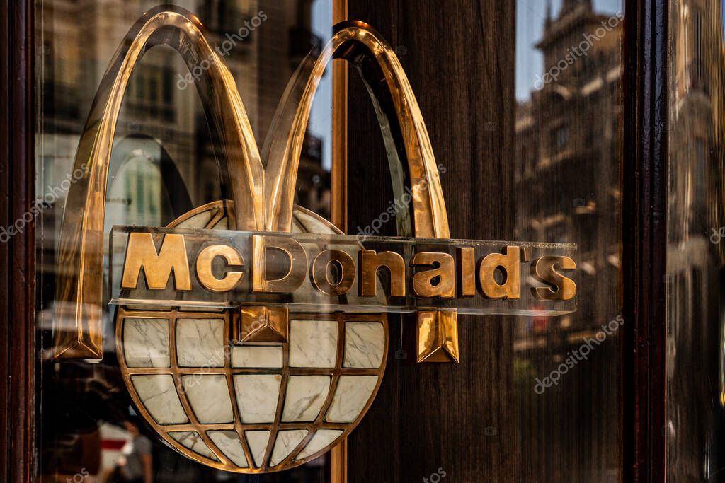 McDonalds logo on a glass door. fast food in madrid, spain 08.06.2025