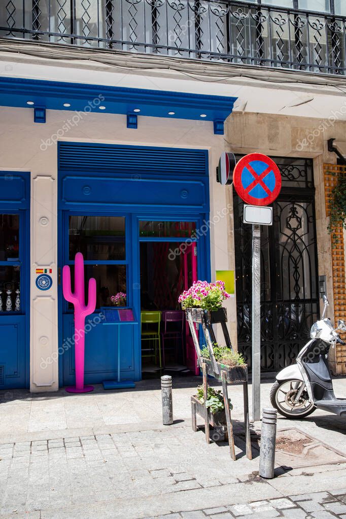 Modern Mexican cuisine restaurant in the city. A stylish restaurant entrance with a pink cactus statue