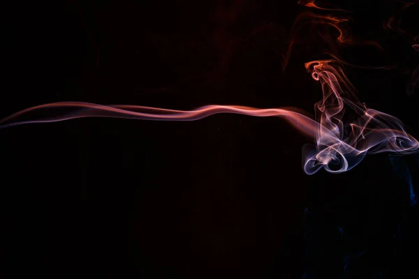 Movement smoke abstract on black background. Abstract smoke Weipa. Personal vaporizers of fragrant steam. The concept of alternative non-nicotine smoking. Electronic Cigarette. Evaporator. Steaming