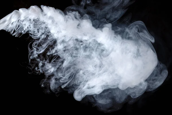 Abstract smoke Weipa. Personal vaporizers of fragrant steam. The concept of alternative non-nicotine smoking. Gray smoke on a black background. Electronic Cigarette. Evaporator. Accept Close-up. Steaming