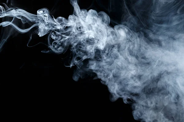 Abstract smoke Weipa. Personal vaporizers of fragrant steam. The concept of alternative non-nicotine smoking. Gray smoke on a black background. Electronic Cigarette. Evaporator. Accept Close-up. Steaming