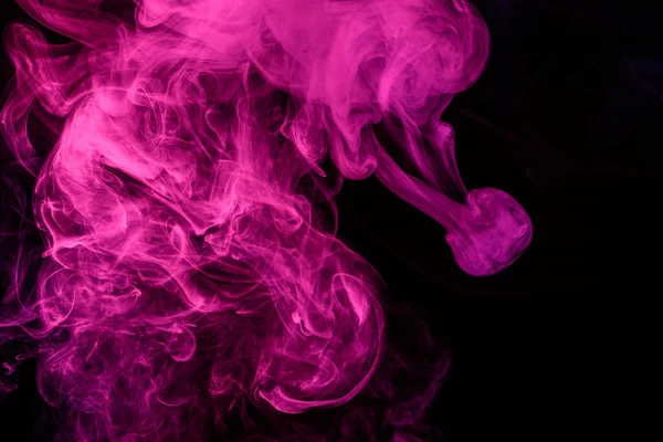 Abstract smoke Weipa. Personal vaporizers of fragrant steam. The concept of alternative non-nicotine smoking. Colorful smoke on a black background. Electronic Cigarette. Evaporator. Accept Close-up. Steaming
