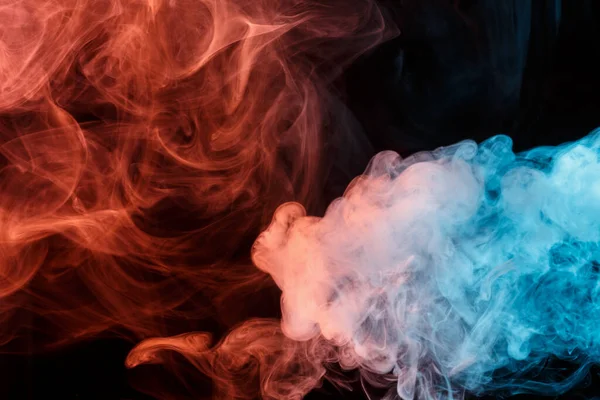 Abstract smoke Weipa. Personal vaporizers of fragrant steam. The concept of alternative non-nicotine smoking. Colorful smoke on a black background. Electronic Cigarette. Evaporator. Accept Close-up. Steaming