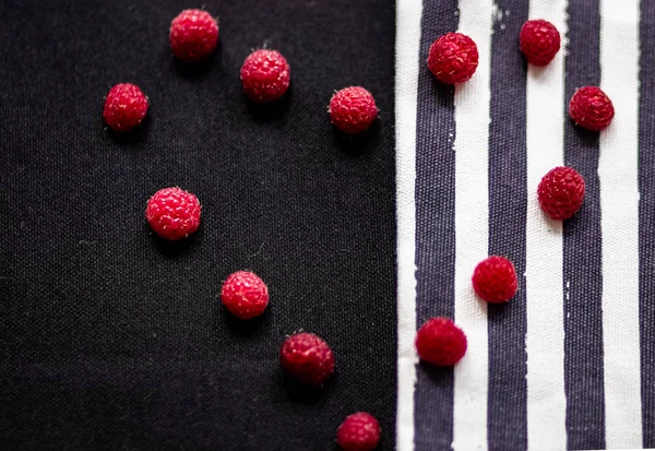 Multicolored stripes and solid background, raspberry berries, fabric, texture