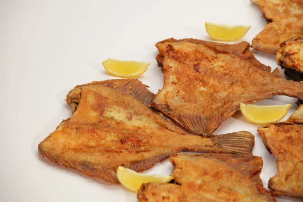 Fried sea flat fish with lemon
