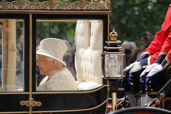 Queen Elizabeth, London, UK - 8 / 6 / 19: Queen Elizabeth travels to Buckingham Palace in carriage, trooping the colour stock photo photo image
