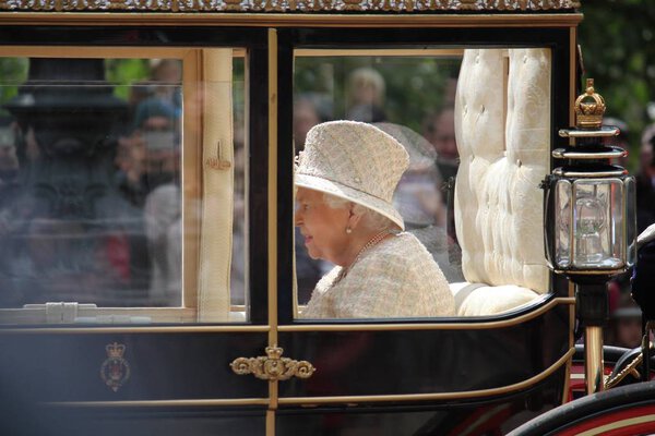 Queen Elizabeth, London, UK - 8 / 6 / 19: Queen Elizabeth travels to Buckingham Palace in carriage, trooping the colour stock photo photo image
