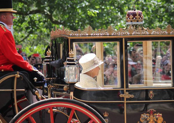 Queen Elizabeth, London, UK - 8 / 6 / 19: Queen Elizabeth travels to Buckingham Palace in carriage, trooping the colour stock photo photo image
