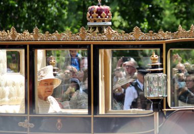 Queen Elizabeth, London, UK - 8/6/19 : Queen Elizabeth travels to Buckingham Palace in carriage, after inspecting the guards on Birthday trooping the colour stock photo photograph image.  clipart