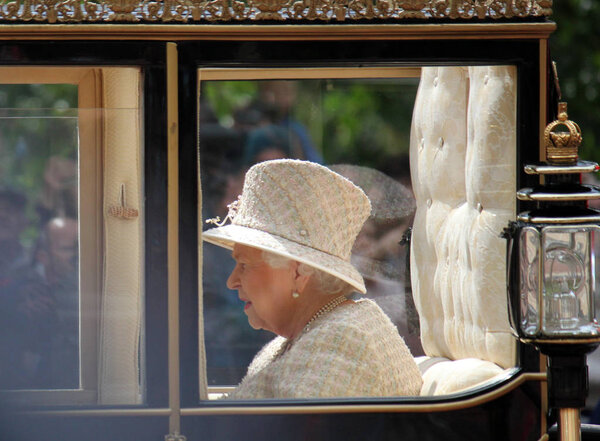 Queen Elizabeth, London, UK - 8 / 6 / 19: Queen Elizabeth travels to Buckingham Palace in carriage, after inspecting the guards on Birthday trooping the colour stock photo photo image
. 