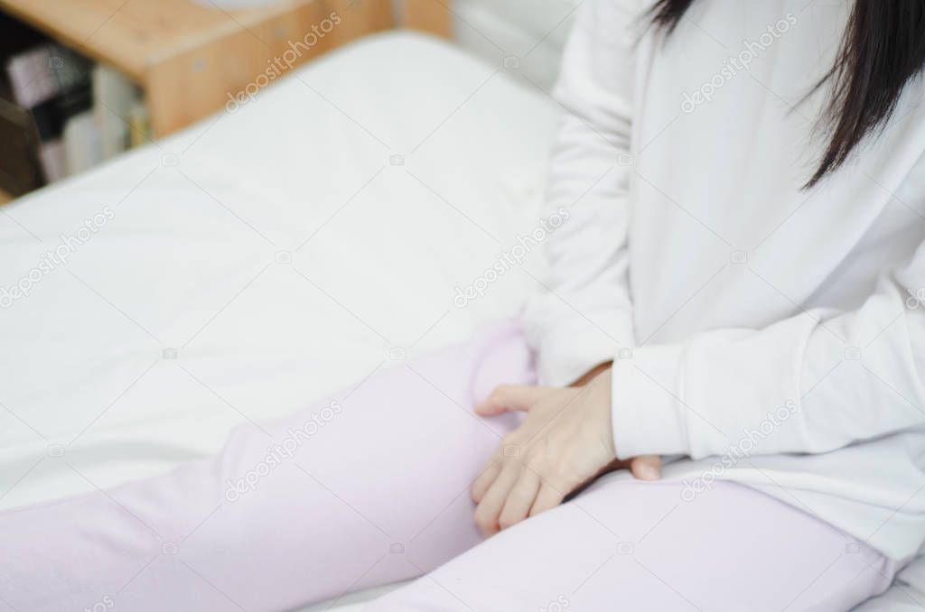 Woman wearing pink pants the itching on vaginal. Genital itching caused by fungus in underwear.