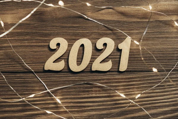 New Year 2021 Gold Numbers Luminous Garland Dark Wooden Table — Stock Photo, Image