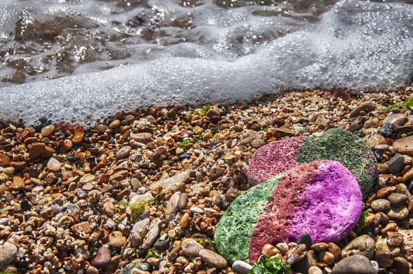 Sea stones and sea foam. Green, red and pink sea stone