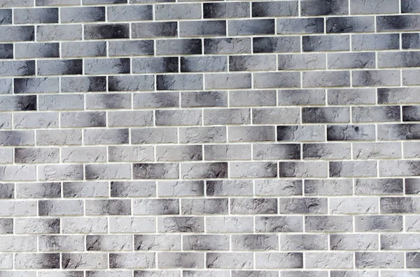 Neat textured wall of bricks, grey white black background — Stock Photo, Image