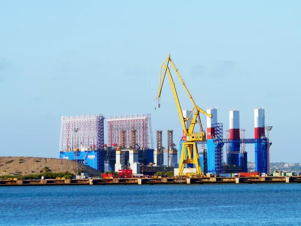 Cranes to repair boats in the bay of Cadiz capital, Andalusia. Spain. Europe