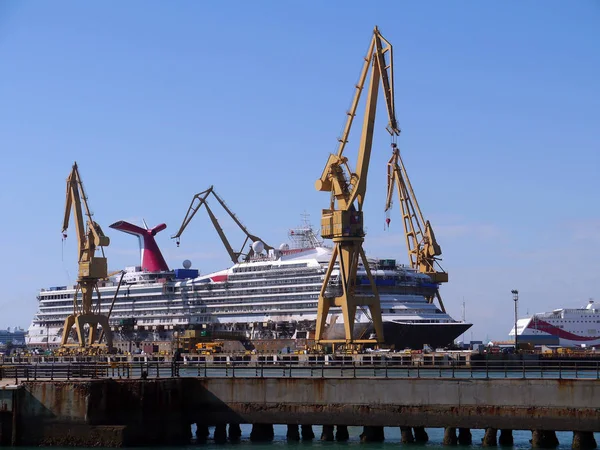 Cranes to repair boats in the bay of Cadiz capital, Andalusia. Spain. Europe