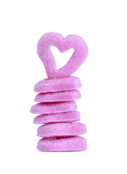 Pink sugar hearts in stack isolated on white — ストック写真