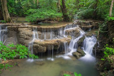 Huay Mae Kamin Waterfall, beautiful waterfall in rainforest at K clipart