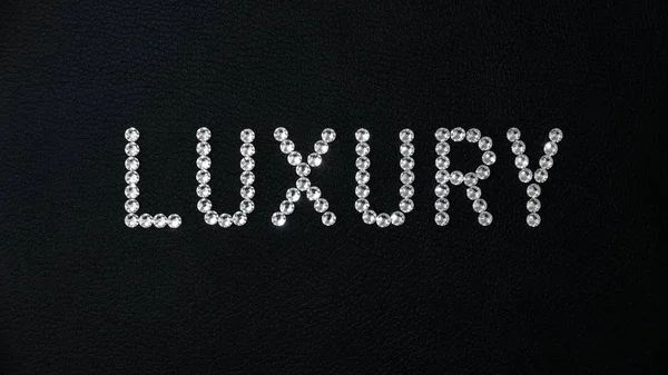 Word Luxury Made Shiny White Swarovski Crystals Placed Black Leather — Stock Photo, Image