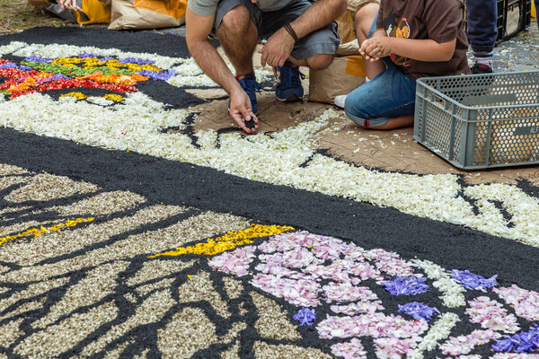 la Orotava, Tenerife, Spain - June 27, 2019. Beautiful flower carpets in La Orotava during Corpus Christi. Famous religious event and competition of folk art. Warm summer evening and joyful visitors